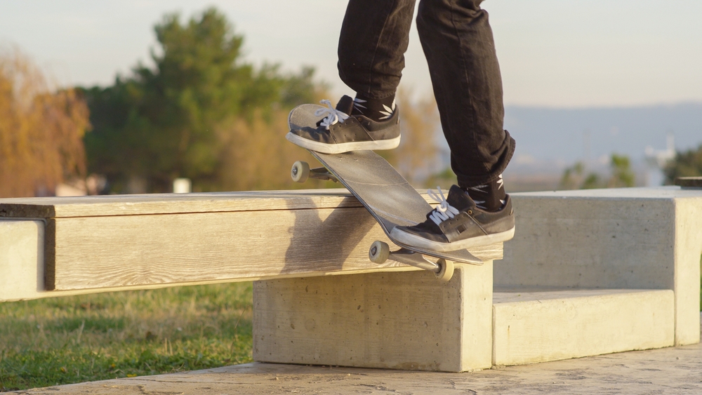 Skateboard Grind Trick on Concrete Ledge - Thomas Augusto Close-up of a skateboard performing a grind trick on a concrete ledge, capturing precision and control. - Thomas Augusto