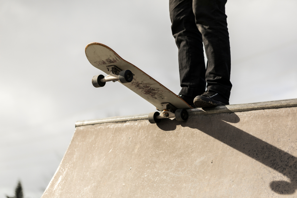 Skateboard Drop-In on Ramp Edge Close-Up - Thomas Augusto Close-up of a skateboarder preparing to drop into a ramp, highlighting board control, stance, and precision. - Thomas Augusto